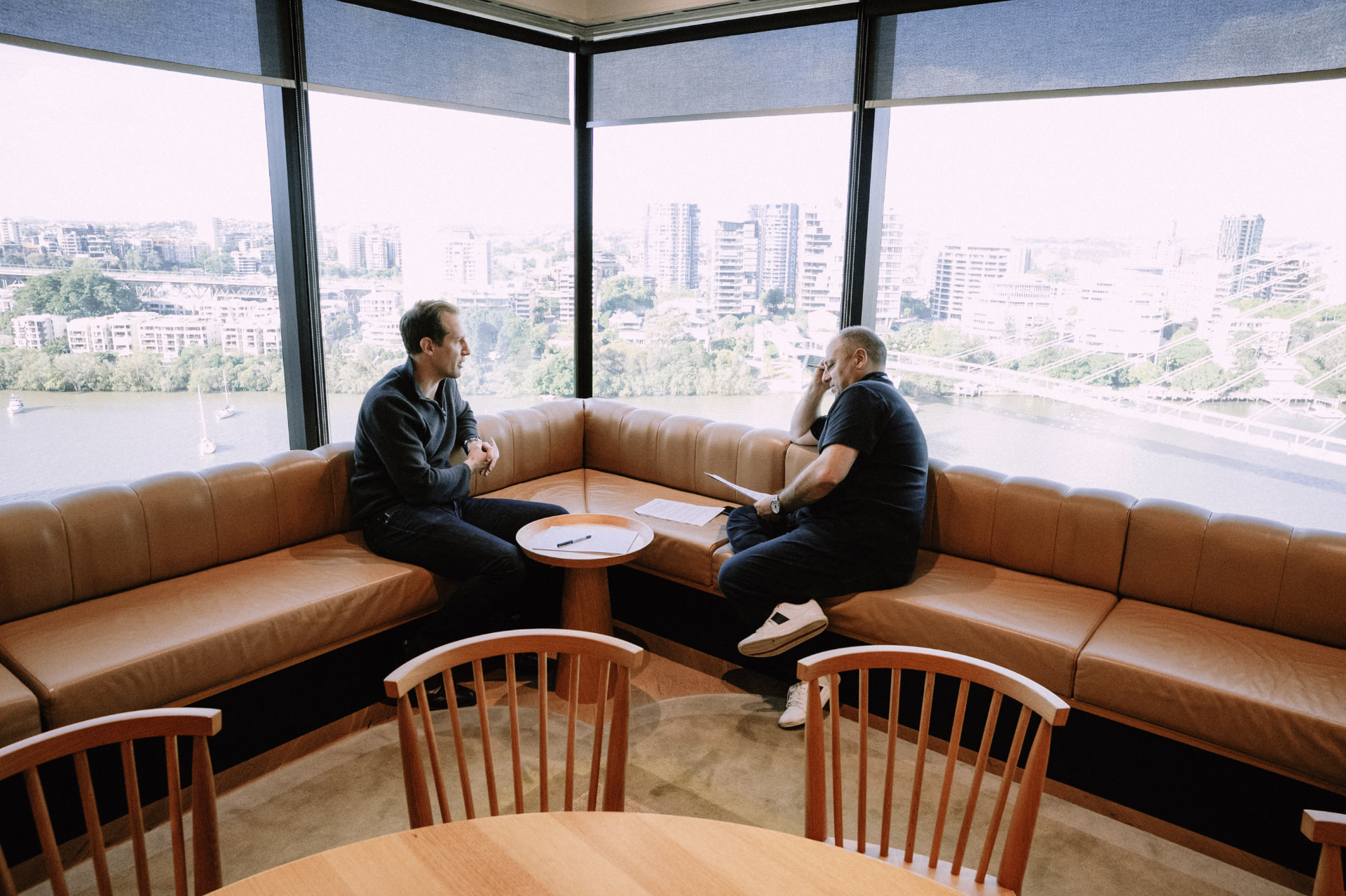 Two members talking by the window