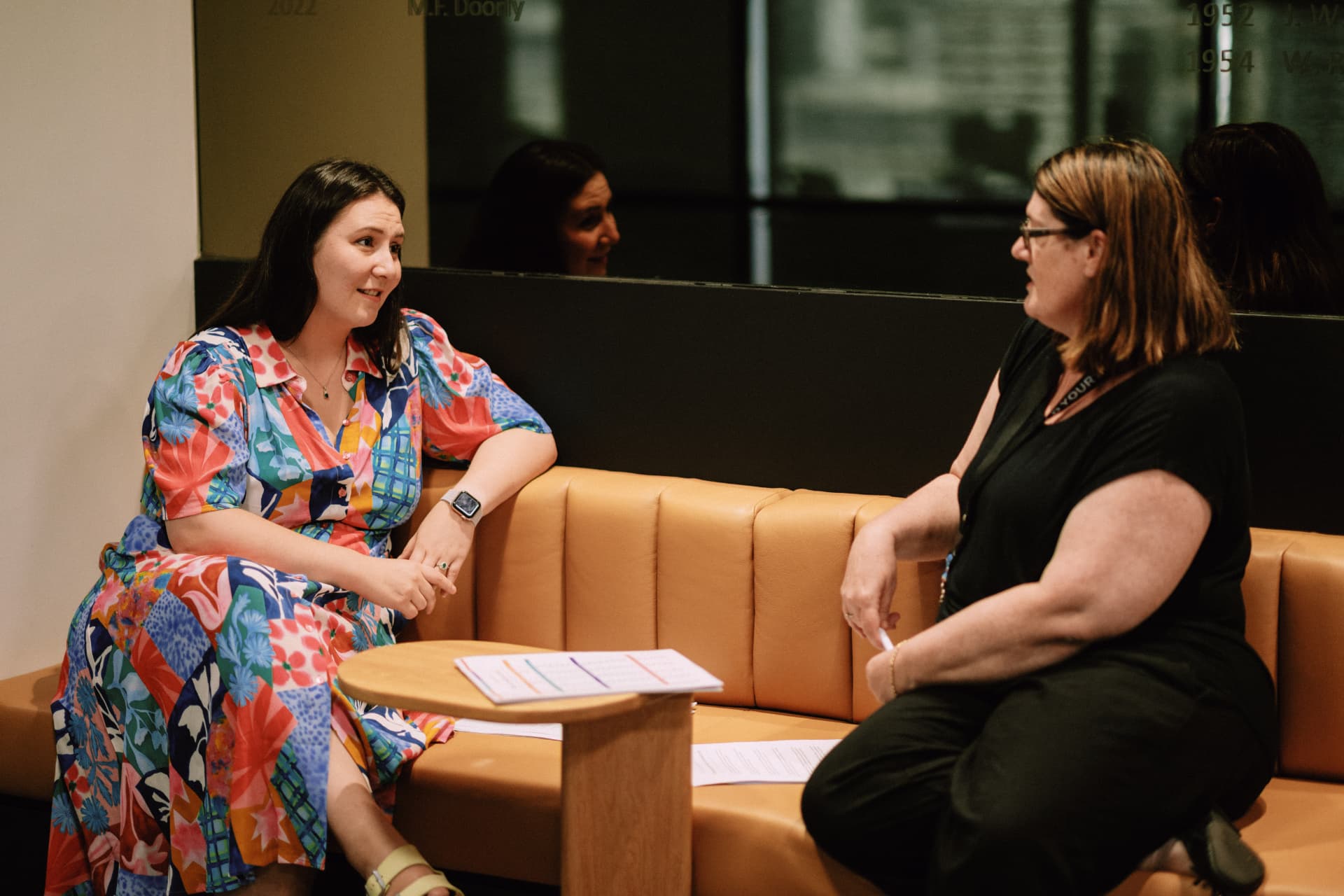 Wize members in conversation on a lounge